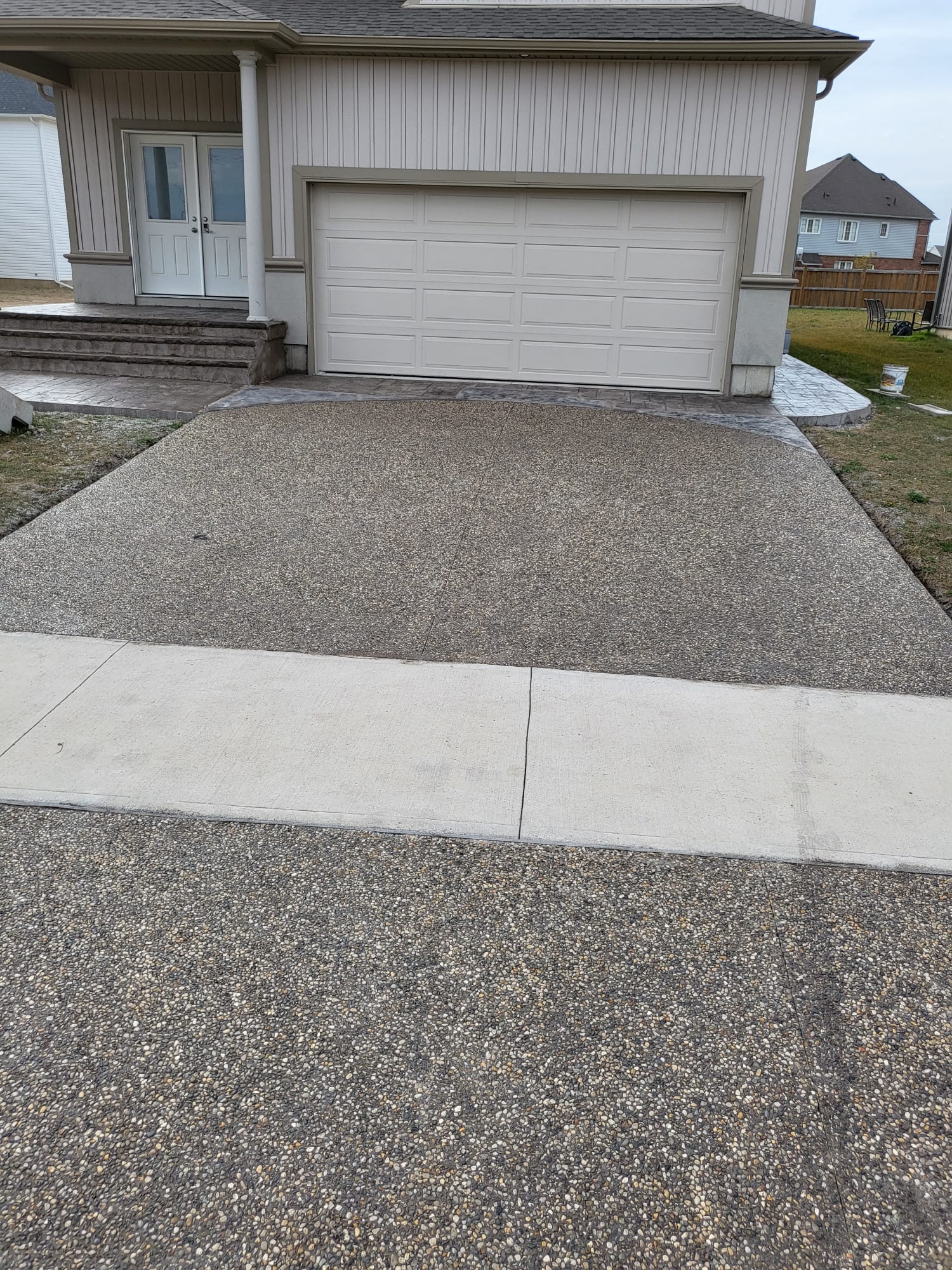Modern curb appeal - exposed aggregate and front yard trends 2026