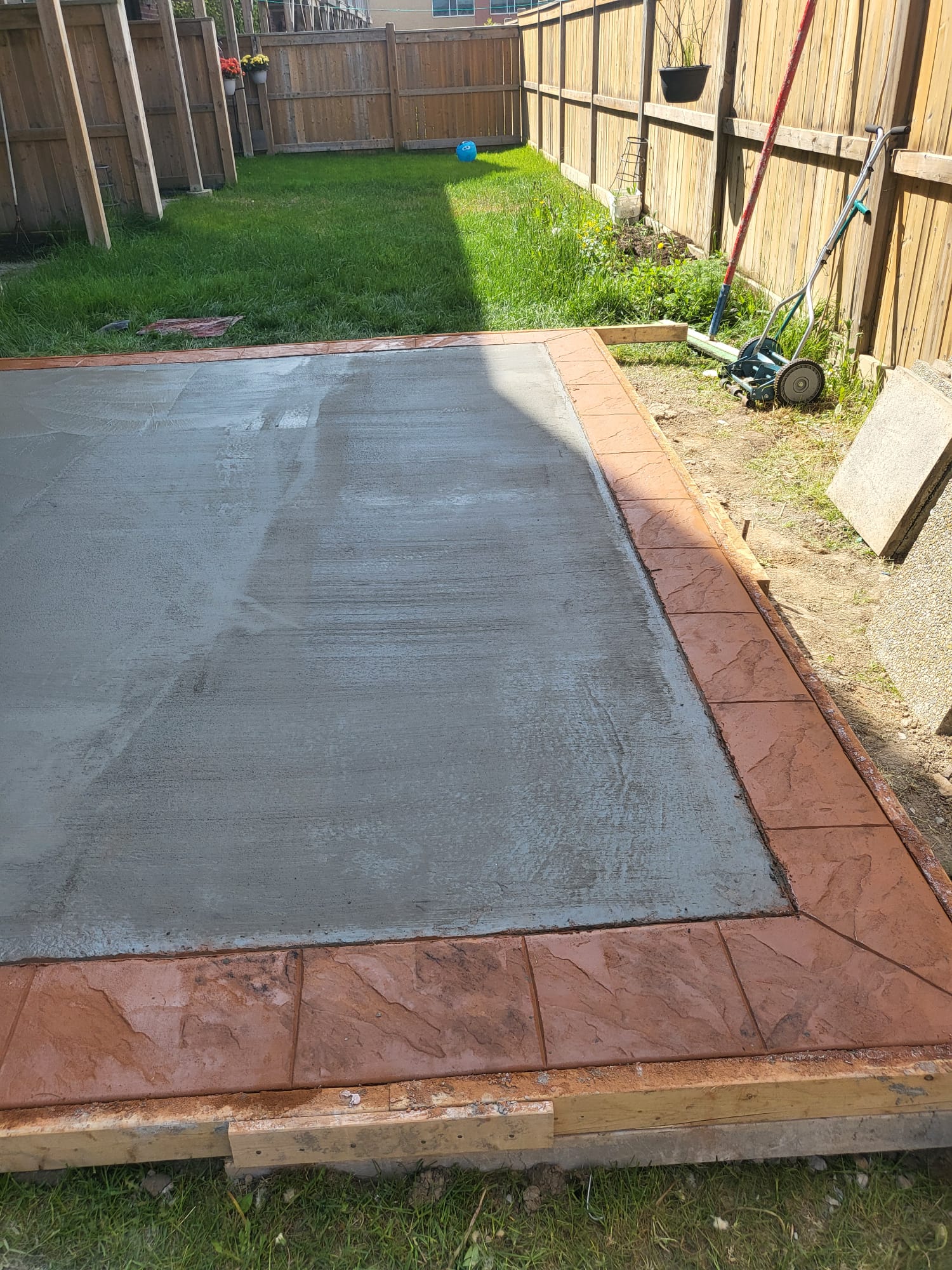 Stamped concrete vs interlock patio - Ontario comparison
