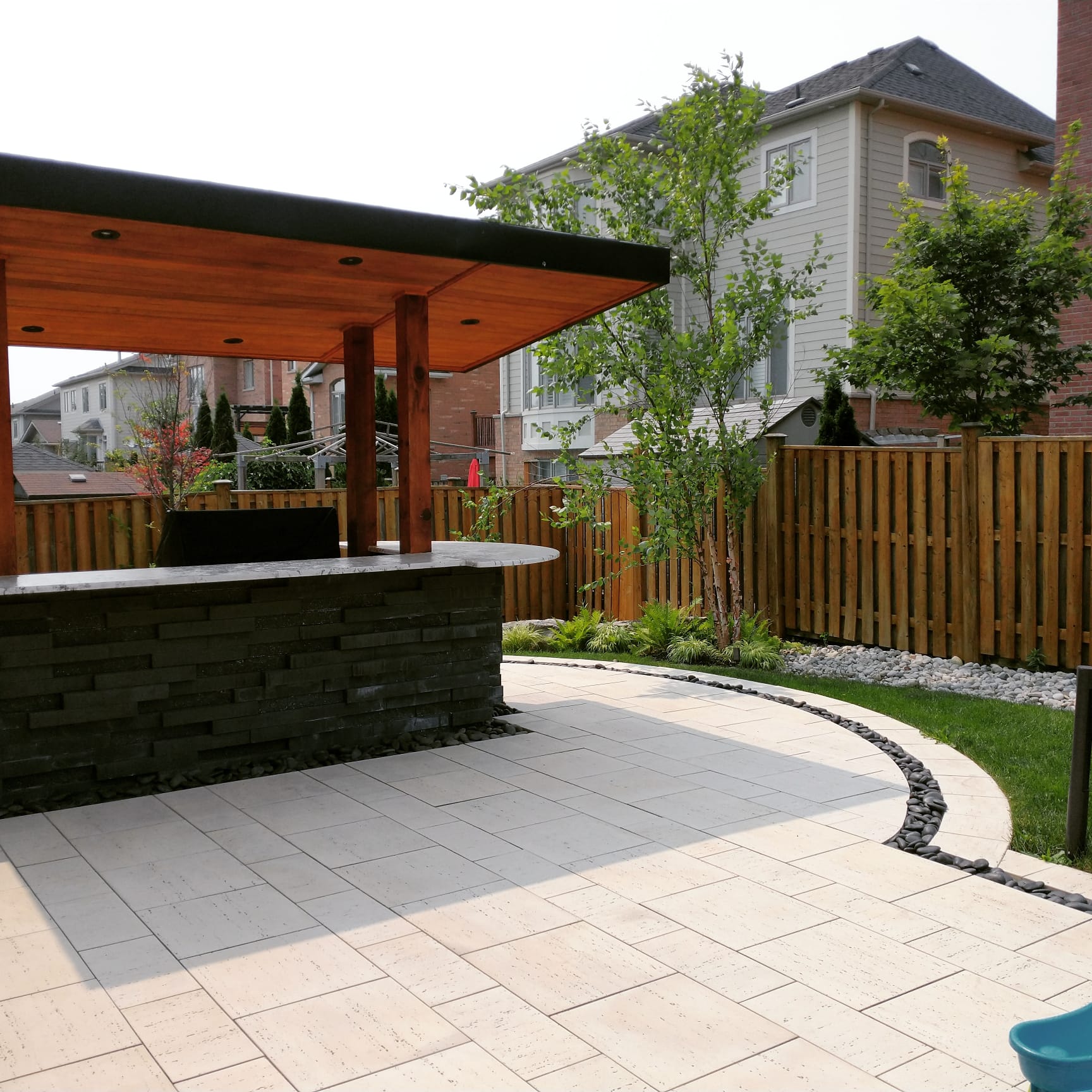 Retaining wall and paver pathway by Seven Stones Landscape — Unilock and Techo-Bloc hardscaping in Hamilton, Ontario